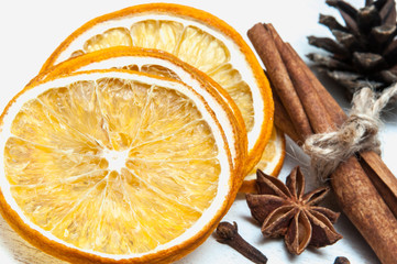Christmas composition - dried orange, anise, cinnamon, cloves. on wooden background