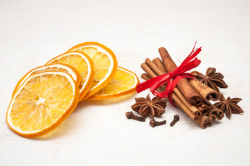 Christmas composition - dried orange, anise, cinnamon, cloves. on wooden background