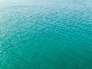 Aerial view of turquoise waves, water surface texture. Thailand