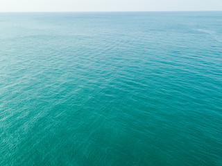 Fototapeta na wymiar Aerial view of turquoise waves, water surface texture. Thailand