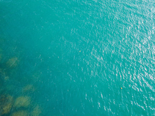Aerial view of turquoise waves, water surface texture. Thailand
