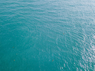 Aerial view of turquoise waves, water surface texture. Thailand