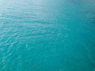 Aerial view of turquoise waves, water surface texture. Thailand