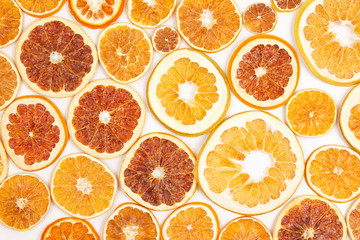 large number of dried lemon slices on a white background. vitamin fruit food