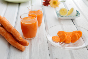 Carrot juice, sliced carrots, and boiled eggs.