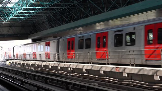 Metro train leaves from subway station.