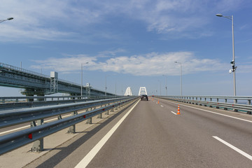 Automotive orange cones narrowing the road due to maintenance repairs. Crimean bridge