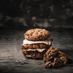 Sweet cookies with on dark textured background.