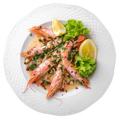 King prawns, or langoustines with sauce and herbs. Gourmet restaurant menu. Isolated on white background. Flat lay top view