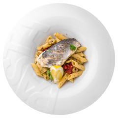 Delicious pasta with trout, sun-dried tomatoes, cream sauce, oregano and lemon. Gourmet restaurant menu. Isolated on white background. Flat lay top view