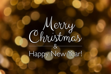 Merry Christmas and happy new year card. Blurry bokeh gold abstract background