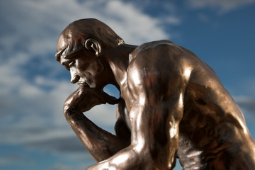 Fototapeta na wymiar Rodin's The Thinker - Replica Bronze Statue