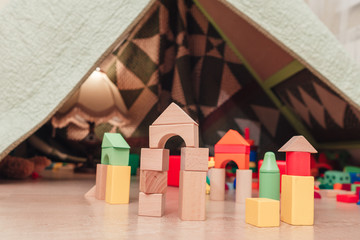 Blocks laying on floor and diy tent