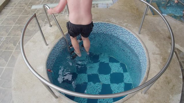 Fat Guy Entering A Cold Pool