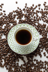 Colombian coffee beans coffee cup on white background