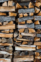 Chopped firewood neatly stacked in a woodpile