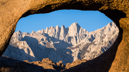 Mount Whitney summit through sandstone archway.