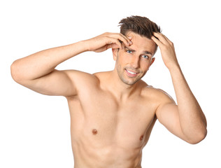 Fototapeta premium Handsome young man after depilation on white background