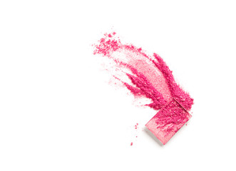 Multicolored crushed eyeshadows with brush isolated on white background.