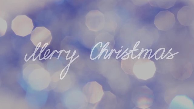 "Merry Christmas" Text agaist Glowing Bokeh Backround