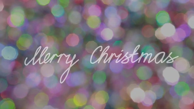 Greeting Christmas Text agaist Glowing Bokeh Backround