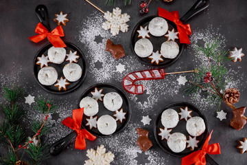 Obraz na płótnie Canvas Christmas decoration,sugar powdered donuts with candy in mini skillet.