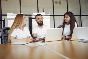 Students create a new project. Team working in a office