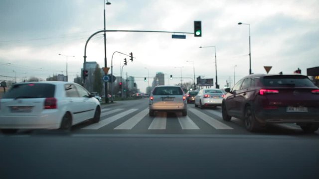 View from the windshield of a car on a highway with cars and taxis in Warsaw. Poland. 24. October. 2019. Car traffic in the city of Warsaw in the evening.