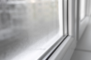 Water condensation on PVC windows during autumn. Plastic window.