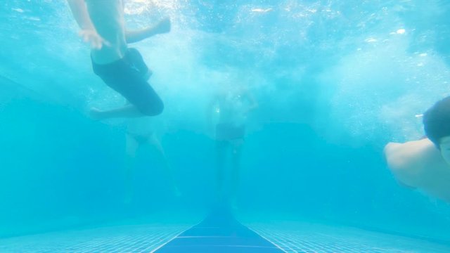 Underwater Shot Of People Entering A Big Pool
