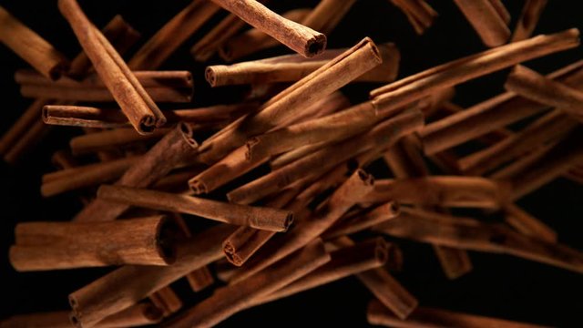 Super slow motion of flying whole cinnamon bark spice. Filmed on high speed camera, 1000 fps