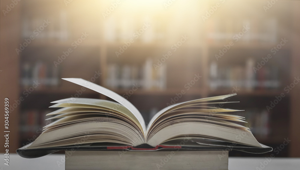 Poster stack of books in the library and blur bookshelf background