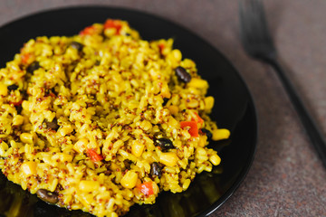 rice and quinoa mix with beans and corn with turmeric and spices