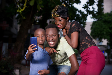 a young family with mobile phone, happy.