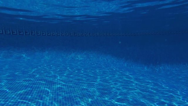 swimming pool underwater, blue water background with copy-space