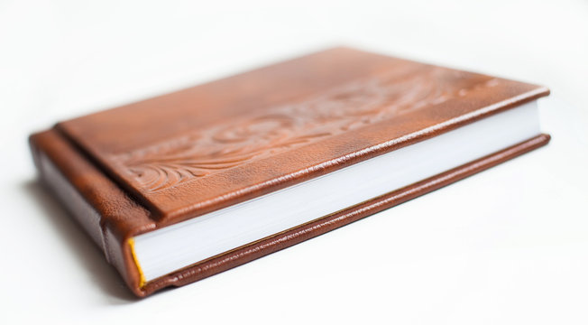 Elegant brown book with beautiful pattern. Wedding photobook. Wedding photo album. White background