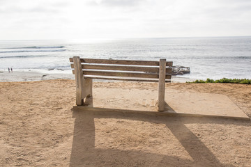 Fototapeta na wymiar bench on the beach