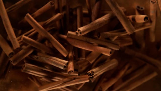 Super slow motion of flying whole cinnamon bark spice. Filmed on high speed camera, 1000 fps