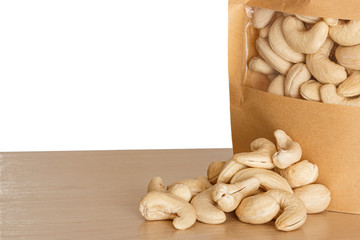 Cashews nut isolated on white background with floor wooden