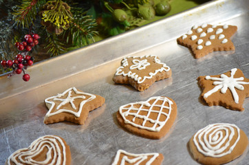 Gingerbread Christmas Cookies on Baking Pan with Decorative Greenery