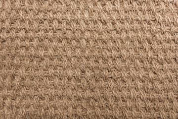 Fabric background of beige sackcloth close-up texture