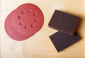 Woodworking tools. Sanding wood for smoothness. Carpenter tools. Emery sponge and emery wheels