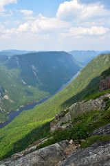 Fototapeta na wymiar Above view (looking north) of the valley floor at the top of the Acrople des Draveurs trail at the Hautes-Gorges-de-la-Rivière-Malbaie National Park (SEPAQ), Charlevoix Region, Quebec, Canada