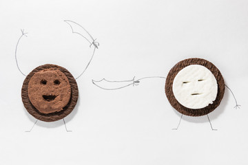 Confrontation of round cookies with different fillings with painted legs, arms and sabers (swords)