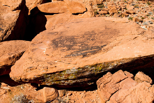 Pre-Columbian petroglyphs on a large rock in its natural setting in Valley of Fire State Park in Nevada