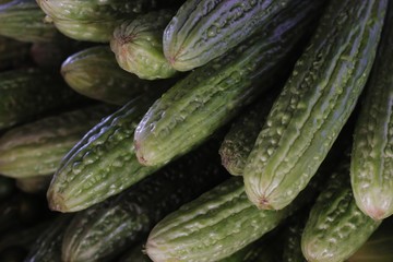 Momordica charantia or bitter gourd, bitter squash, a tropical and subtropical vine widely grown in Asia for its edible fruit. It is also called ampalaya in Philippines.