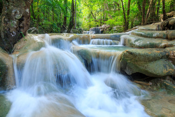 Fototapeta na wymiar Waterfalls In Deep Forest at Erawan Waterfall in National Park Kanchanaburi Thailand