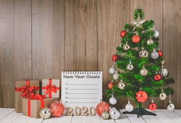 christmas tree with colorful balls ornaments and gift boxes with Notebook
