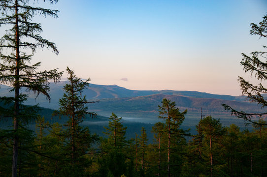 Evening Landscape Of Taiga Nature Of Khabarovsk Region. View From The Top Of The Hill
