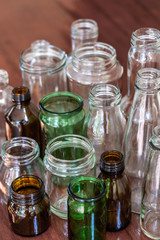 Variety shape and color of empty glass container bottles, reuse things concept